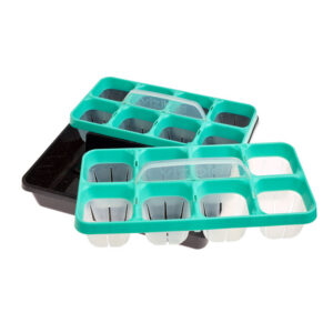 Plastic seedling trays with green inserts